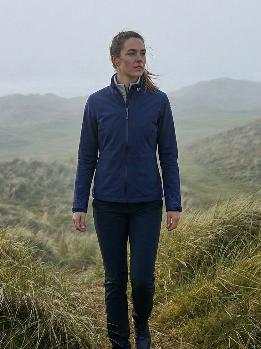women golfer playing golf in misty conditions in UK